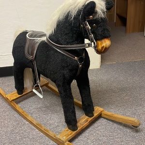 Vintage Stuffed Rocking Horse with a Carved Wood Nose and Hooves.